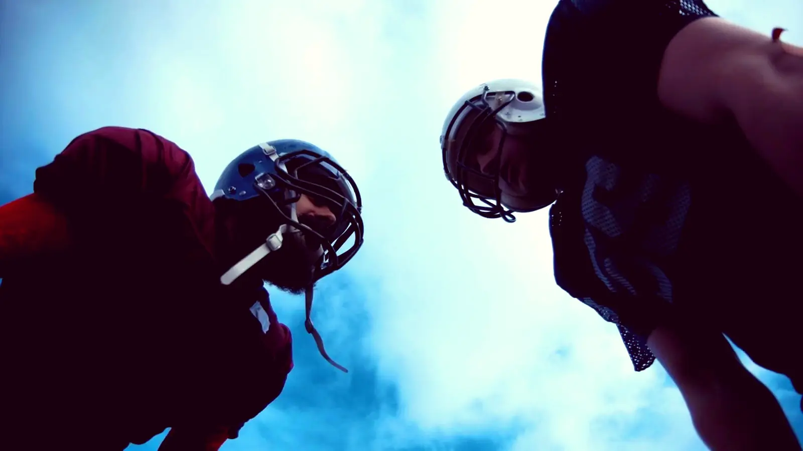 Football players facing off before the snap